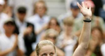 Clijsters survives scare to progress in Paris