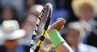 Nadal crushes Baghdatis as Federer scrapes through