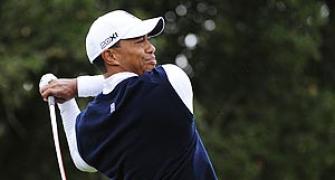 Woods trails, Rookie Steele in tie for lead