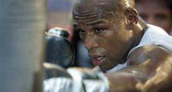 Boxing star Mayweather acquitted of harassment