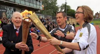 Bannister carries Olympic torch at site of famous mile