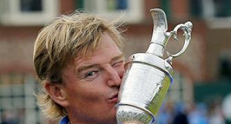 Els wins British Open after late Scott collapse