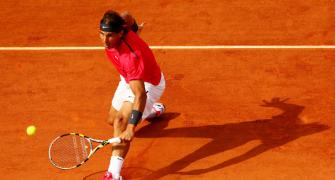Nadal follows Federer into elite French Open club