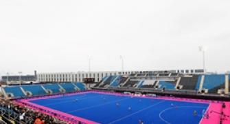 Games organisers defend hockey surface after injury