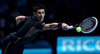 Djokovic battles past Del Potro to win opening semi-final
