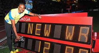 Merritt sets hurdles world record, Bolt, Blake win