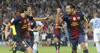 La Liga: Xavi, Messi score late to help Barca stay on top