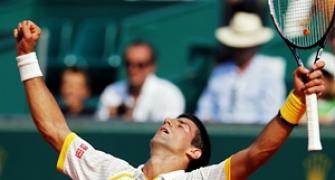 Djokovic battles through pain, Nadal finds it easy