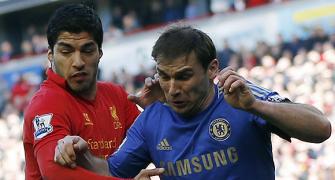 Suarez shows appetite for trouble, bites Chelsea defender