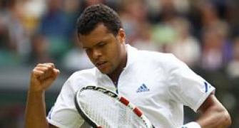 Tsonga saves five match points to knock out Tomic