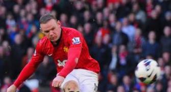 Wenger admits interest in signing Rooney, Fabregas