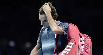 Federer walks off into shadows with clock ticking