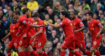 Football round-up: Liverpool, Atletico maintain title bids