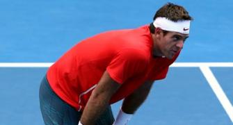 Del Potro beaten, Nadal thrives in scorching Melbourne