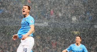 EPL PHOTOS: Manchester City on verge of title after Dzeko double