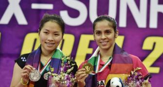 Saina, Srikanth lift India Open Super Series titles