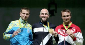 Italy's Campriani takes 10m air rifle gold, Bindra misses medal