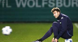Wenger surprised by Bendtner's move to Forest