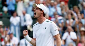 Murray overcomes brutal tussle to reach last 16
