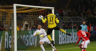 Aubameyang hat-trick leads Dortmund into last eight