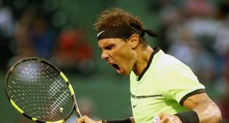 PHOTOS: Nadal wins in 1000th match, Raonic withdraws