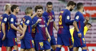 Messi strikes twice in empty Nou Camp