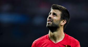 Catalan Pique jeered by fans at Spain training session