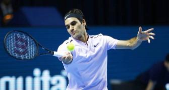Razor-sharp Federer races through in Basel