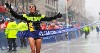 PIX: Kawauchi, Linden record shock wins in rain-soaked Boston Marathon