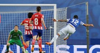 Football briefs: Barca sniff title after Atletico lose