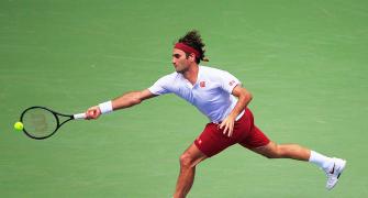 US Open PIX: Federer, Djokovic advance; Wozniacki crashes out
