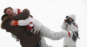 Winter OIympics PIX: US snowboarder White stamps legacy with third gold