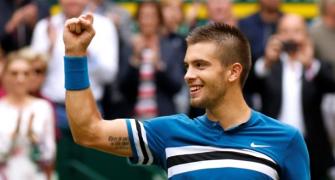 Federer loses No 1 spot as Coric stuns him in Halle final