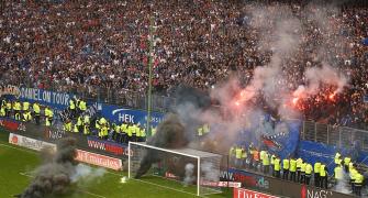 PIX: German giants Hamburg relegated; fans chaos engulfs stadium