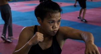 Boxer beats stereotypes to become 'Queen of the Ring'