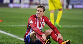 Soccer Extras: Spain striker Torres retires