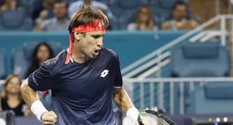 Federer fights back; Osaka stunned