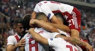 PHOTOS: Olympiakos hold Spurs, City win