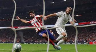 Real Madrid top La Liga after derby draw at Atletico