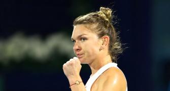 Halep labours to victory on comeback at Prague Open