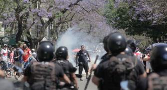 PHOTOS: Riot breaks out at Maradona's funeral