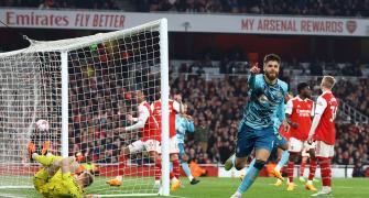 PICS: Arsenal stage late escape, but title hopes hit