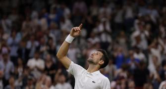 Djokovic survives Wawrinka's late surge
