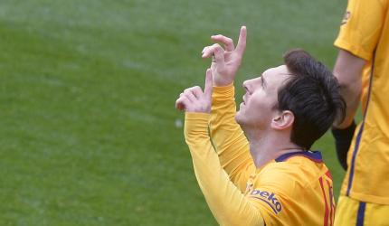 Messi double keeps Barcelona's record rolling