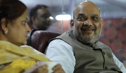 PIX: On Karnataka poll day, Amit Shah enjoys IPL game