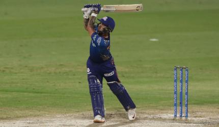 IPL PIX: Mumbai humble Royals to stay in play-off race