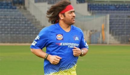 Dhoni Unveils Retro Look: Back to Long Hair, Bandanas