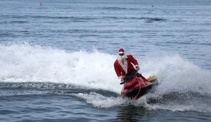 Santa Arrives On A Jet Ski!