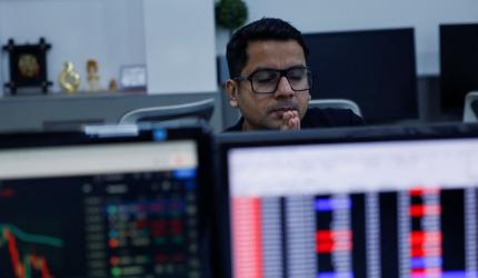 Sensex falls 200 pts dragged by realty, auto shares