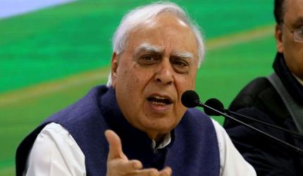 Gandhis should step aside, says Sibal; Cong hits back